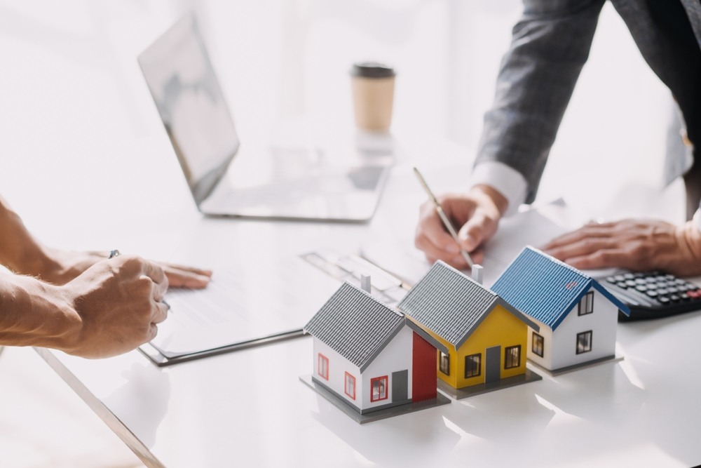 Custom home planning documents laid out before construction