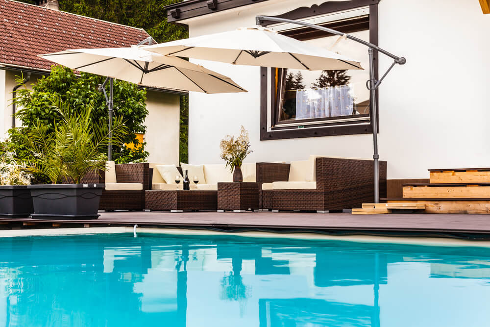 Custom pool house with covered patio in a Phoenix backyard